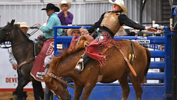 Ethan Cart holds on during saddle bronc riding at the Texas High School Rodeo Association’s state finals Tuesday in Abilene June 10, 2025. 
