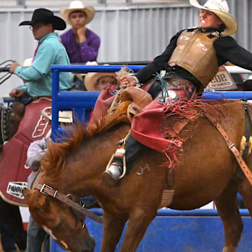 Ethan Cart holds on during saddle bronc riding at the Texas High School Rodeo Association’s state finals Tuesday in Abilene June 10, 2025. 