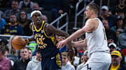 Feb 24, 2025; Indianapolis, Indiana, USA; Indiana Pacers forward Pascal Siakam (43) dribbles the ball while Denver Nuggets center Nikola Jokic (15) defends in the second half at Gainbridge Fieldhouse. Mandatory Credit: Trevor Ruszkowski-Imagn Images