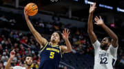 Michigan forward Terrance Williams II (5) makes a layup against Penn State forward Qudus Wahab (22) during the first half of the First Round of Big Ten tournament at Target Center in Minneapolis, Minn. on Wednesday, March 13, 2024.