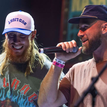 George Kittle and Travis Kelce greet the crowd during the “Tight Ends & Friends” concert at Brooklyn Bowl Tuesday, June 18, 2024 in Nashville, Tenn.