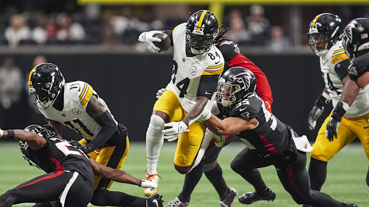 Sep 8, 2024; Atlanta, Georgia, USA; Pittsburgh Steelers running back Cordarrelle Patterson (84) runs against Atlanta Falcons linebacker Kaden Elliss (55) at Mercedes-Benz Stadium. Mandatory Credit: Dale Zanine-Imagn Images