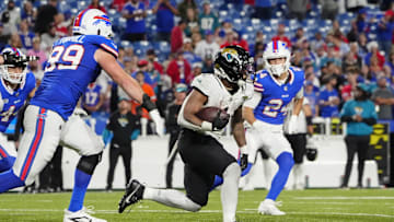 Sep 23, 2024; Orchard Park, New York, USA; Jacksonville Jaguars running back Travis Etienne Jr. (1) runs against the Buffalo Bills during the second half at Highmark Stadium. 