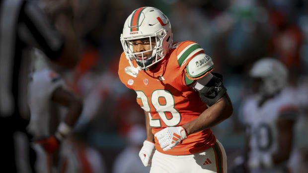 Miami Hurricanes running back Ajay Allen (28) looks on after scoring a touchdown against the Virginia Cavaliers