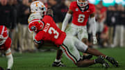 Tennessee Volunteers running back Dylan Sampson is tackled by Georgia Bulldogs linebacker CJ Allen.