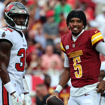 Sep 8, 2024; Tampa, Florida, USA;  Washington Commanders quarterback Jayden Daniels (5) looks on after he lost his helmet against the Tampa Bay Buccaneers during the first half at Raymond James Stadium. Mandatory Credit: Kim Klement Neitzel-Imagn Images