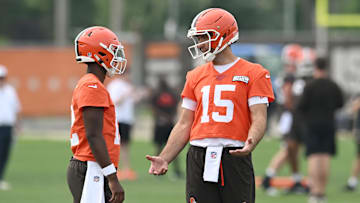Jun 12, 2025; Berea, OH, USA; Cleveland Browns quarterback Joe Flacco (15) talks to quarterback Shedeur Sanders (12) during mini camp at CrossCountry Mortgage Campus. Mandatory Credit: Ken Blaze-Imagn Images