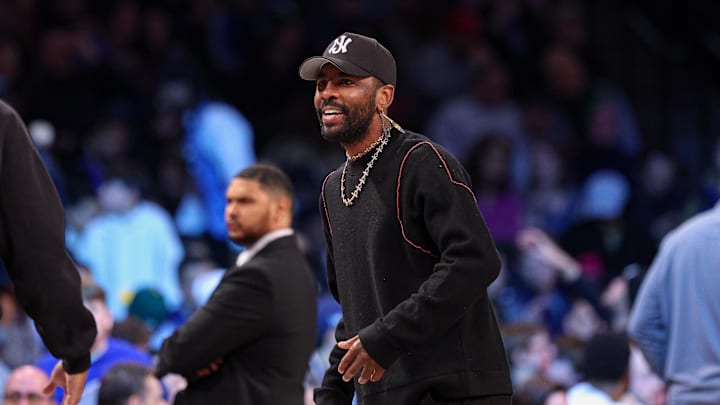 Dallas Mavericks guard Kyrie Irving looks on during the first quarter against the Brooklyn Nets. Dallas Mavericks guard Kyrie Irving looks on during the first quarter against the Brooklyn Nets.