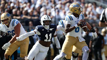 Oct 5, 2024; University Park, Pennsylvania, USA; Penn State Nittany Lions defensive end Abdul Carter (11) pressures UCLA Bruins quarterback Jaylin Davies (6) during the third quarter at Beaver Stadium. Mandatory Credit: Matthew O'Haren-Imagn Images