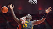 Illinois Fighting Illini forward Jake Davis (15) fouls Iowa Hawkeyes forward Ladji Dembele (13) during the second half at State Farm Center. 