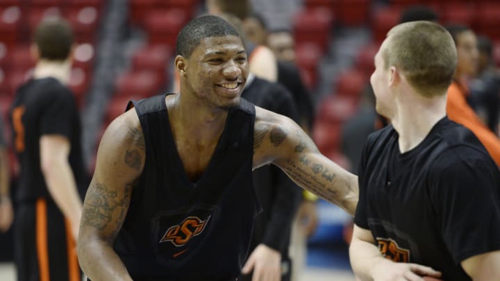 Mar 20, 2014; San Diego, CA, USA; Oklahoma State Cowboys guard Marcus Smart (left) tries to take the ball away from guard Phil Forte, III (right) during practice before the second round of the 2014 NCAA Tournament at Viejas Arena. Mandatory Credit: Robert Hanashiro-USA TODAY Sports
