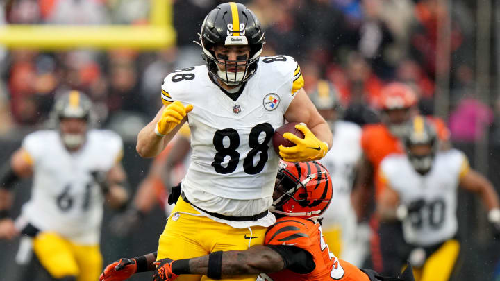 Pittsburgh Steelers tight end Pat Freiermuth (88) is tackled by Cincinnati Bengals safety Nick Scott (33) after a catch a in the first quarter of a Week 12 NFL football game between the Pittsburgh Steelers and the Cincinnati Bengals, Sunday, Nov. 26, 2023, at Paycor Stadium.