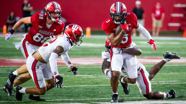 Indiana's Omar Cooper Jr. (3) runs after the catch during the Indiana football spring game at Memorial Stadaium on Thursday, April 18, 2024.