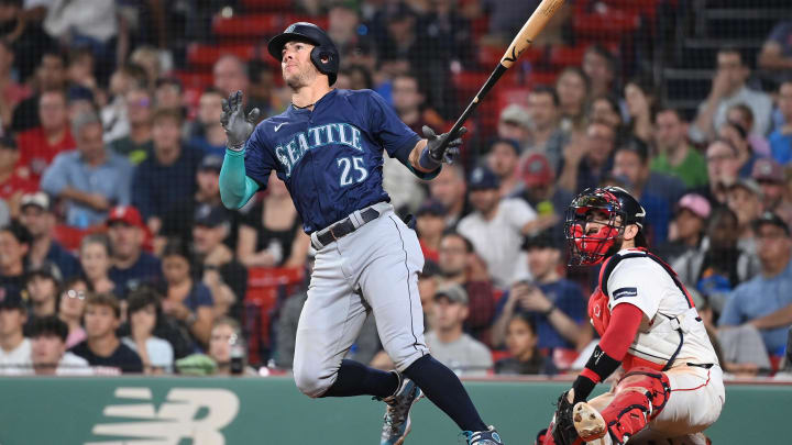 Seattle Mariners shortstop Dylan Moore hits an RBI single against the Boston Red Sox on Monday at Fenway Park. 