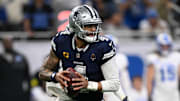 Dallas Cowboys quarterback Dak Prescott rolls out during the first half against the Detroit Lions at Ford Field. 
