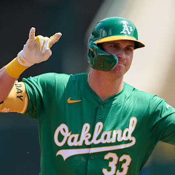 Aug 24, 2024; Oakland, California, USA; Oakland Athletics outfielder JJ Bleday (33) gestures toward the Oakland Athletics dugout after hitting a one run home run against the Milwaukee Brewers during the first inning at Oakland-Alameda County Coliseum.