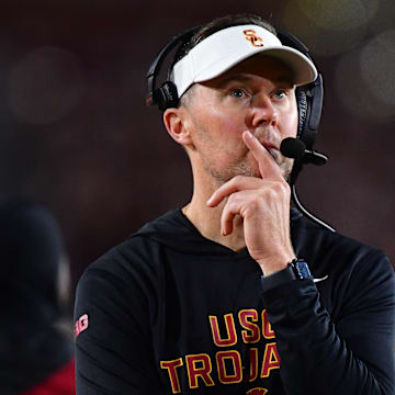Nov 7, 2025; Los Angeles, California, USA; Southern California Trojans head coach Lincoln Riley watches game action against the Northwestern Wildcats during the second half at the Los Angeles Memorial Coliseum. Mandatory Credit: Gary A. Vasquez-Imagn Images