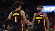 Dec 6, 2025; Washington, District of Columbia, USA; Atlanta Hawks forward Jalen Johnson (1) celebrates with Hawks guard Nickeil Alexander-Walker (7) after scoring while being fouled against the Washington Wizards in the second half at Capital One Arena. Mandatory Credit: Geoff Burke-Imagn Images