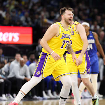 Mar 24, 2025; Orlando, Florida, USA; Los Angeles Lakers guard Luka Doncic (77) reacts after a basket against the Orlando Magic in the first quarter at Kia Center. Mandatory Credit: Nathan Ray Seebeck-Imagn Images