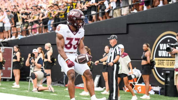 Aug 31, 2024; Nashville, Tennessee, USA;  Virginia Tech Hokies running back Bhayshul Tuten (33) scores a touchdown against the Vanderbilt Commodores] during the second half at FirstBank Stadium. Mandatory Credit: Steve Roberts-USA TODAY Sports