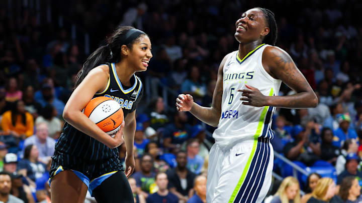 May 15, 2024; Arlington, Texas, USA;  Chicago Sky forward Angel Reese (5) laughs with Dallas Wings forward Natasha Howard (6) during the second half at College Park Center. Mandatory Credit: Kevin Jairaj-Imagn Images