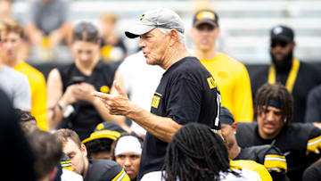 Aug 9, 2025; Iowa head coach Kirk Ferentz talks with players during the Hawkeyes Kids Day NCAA football open practice at Kinnick Stadium in Iowa City, Iowa. Mandatory Credit: Joseph Cress for the Des Moines Register