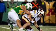 Oregon outside linebacker Teitum Tuioti sacks Minnesota quarterback Drake Lindsey as the Oregon Ducks host the Minnesota Golden Gophers on Nov. 14, 2025, at Autzen Stadium in Eugene, Oregon.