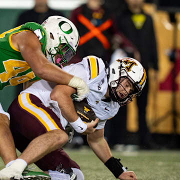 Oregon outside linebacker Teitum Tuioti sacks Minnesota quarterback Drake Lindsey as the Oregon Ducks host the Minnesota Golden Gophers on Nov. 14, 2025, at Autzen Stadium in Eugene, Oregon.