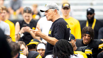 Aug 9, 2025; Iowa head coach Kirk Ferentz talks with players during the Hawkeyes Kids Day NCAA football open practice at Kinnick Stadium in Iowa City, Iowa. Mandatory Credit: Joseph Cress for the Des Moines Register