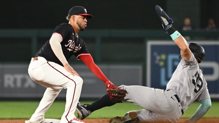 Aug 28, 2024; Washington, District of Columbia, USA; New York Yankees center fielder Aaron Judge (99) slides into second base in front of Washington Nationals second baseman Luis Garcia Jr. (2) during the fifth inning at Nationals Park. Mandatory Credit: Rafael Suanes-USA TODAY Sports