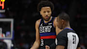 Mar 1, 2024; Detroit, Michigan, USA;  Detroit Pistons guard Cade Cunningham (2) talks to referee Dedric Taylor (21) in the second half against the Cleveland Cavaliers at Little Caesars Arena. Mandatory Credit: Rick Osentoski-Imagn Images