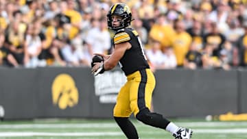 Aug 30, 2025; Iowa City, Iowa, USA; Iowa Hawkeyes quarterback Mark Gronowski (11) prepares to throw a pass against the Albany Great Danes during the first quarter at Kinnick Stadium. Mandatory Credit: Jeffrey Becker-Imagn Images