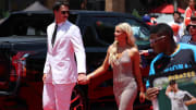 Jul 16, 2024; Arlington, Texas, USA; Pittsburgh Pirates pitcher Paul Skenes walks the red carpet with LSU gymnast and girlfriend Livvy Dunne before the 2024 MLB All-Star game at Globe Life Field. Mandatory Credit: Kevin Jairaj-USA TODAY Sports
