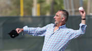 Feb 15, 2023; Jupiter, FL, USA;  John Mozeliak, St. Louis Cardinals President of Baseball Operations, throws a baseball during spring training in Jupiter, Florida. 