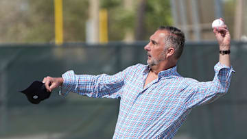 Feb 15, 2023; Jupiter, FL, USA;  John Mozeliak, St. Louis Cardinals President of Baseball Operations, throws a baseball during spring training in Jupiter, Florida. 