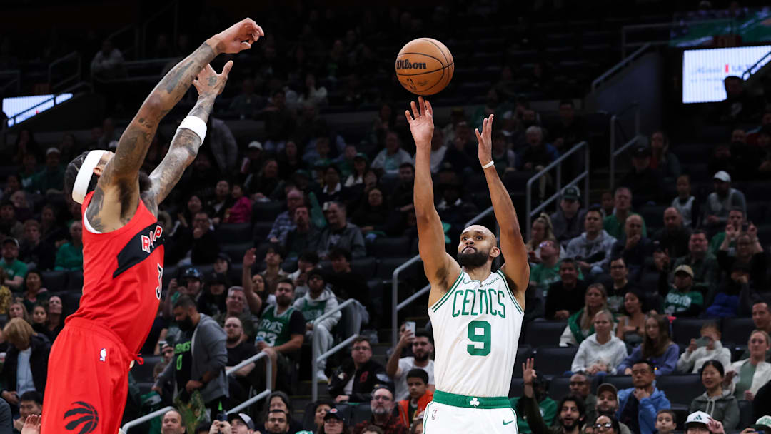 Oct 15, 2025; Boston, Massachusetts, USA; Boston Celtics guard Derrick White (9) shoots during the first half against the Toronto Raptors at TD Garden. Mandatory Credit: Paul Rutherford-Imagn Images