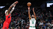 Oct 15, 2025; Boston, Massachusetts, USA; Boston Celtics guard Derrick White (9) shoots during the first half against the Toronto Raptors at TD Garden. Mandatory Credit: Paul Rutherford-Imagn Images