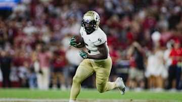 Sep 7, 2024; Tuscaloosa, Alabama, USA; South Florida Bulls running back Nay'Quan Wright (5) runs the ball against the Alabama Crimson Tide during the fourth quarter at Bryant-Denny Stadium. Mandatory Credit: William McLelland-Imagn Images