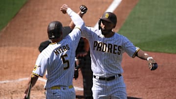 San Diego Padres first baseman Eric Hosmer (30) is congratulated by right fielder Wil Myers (5) after hitting a home run during the third inning against the Arizona Diamondbacks at Petco Park on April 1, 2021.
