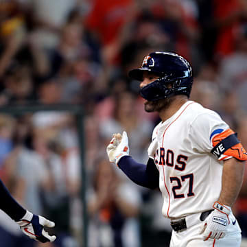 Houston Astros second baseman Jose Altuve (27) is congratulated by Houston Astros designated hitter Yordan Alvarez (44) after hitting a home run against the Arizona Diamondbacks during the seventh inning at Minute Maid Park on Sept 7.