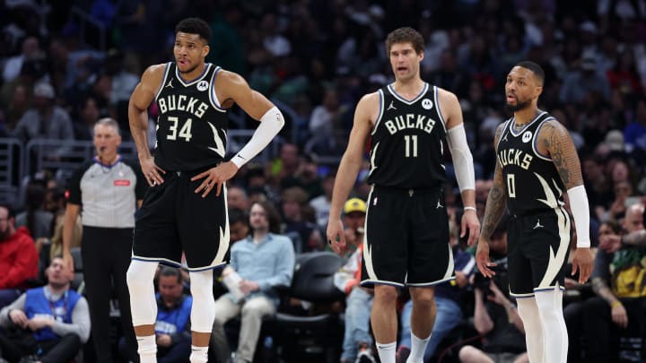 Milwaukee Bucks forward Giannis Antetokounmpo (34) and center Brook Lopez (11) and guard Damian Lillard (0) on the court during the third quarter against the Los Angeles Clippers at Crypto.com Arena. 