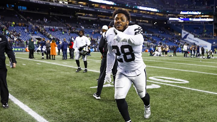 Las Vegas Raiders running back Josh Jacobs celebrates following a 40-34 overtime victory against the Seattle Seahawks in 2022. Las Vegas Raiders running back Josh Jacobs celebrates following a 40-34 overtime victory against the Seattle Seahawks in 2022.