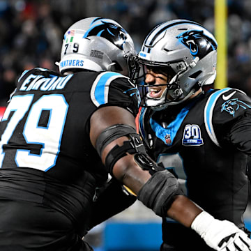 Dec 1, 2024; Charlotte, North Carolina, USA; Carolina Panthers quarterback Bryce Young (9) celebrates with offensive tackle Ikem Ekwonu (79) after the panthers score with 30 seconds left to take the lead in the fourth quarter at Bank of America Stadium. Mandatory Credit: Bob Donnan-Imagn Images