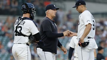 Detroit Tigers manager A.J. Hinch (14) takes the ball to relieve pitcher Jack Flaherty (9) in the seventh inning against the Tampa Bay Rays at Comerica Park.