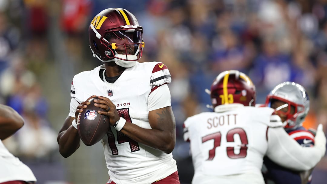Aug 8, 2025; Foxborough, Massachusetts, USA; Washington Commanders quarterback Josh Johnson (14) drops back to pass during the first half against the New England Patriots at Gillette Stadium. Mandatory Credit: Paul Rutherford-Imagn Images