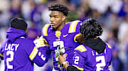 LSU Tigers wide receiver Kyren Lacy hugs his family as seniors are being honored at Tiger Stadium. 
