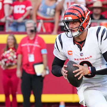 Sep 15, 2024; Kansas City, Missouri, USA; Cincinnati Bengals quarterback Joe Burrow (9) drops back to pass against the Kansas City Chiefs during the game at GEHA Field at Arrowhead Stadium. Mandatory Credit: Denny Medley-Imagn Images