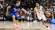 Jul 12, 2025; Las Vegas, NV, USA; Dallas Mavericks forward Cooper Flagg (32) defends against San Antonio Spurs guard Dylan Harper (2) in the second quarter of their game at Thomas & Mack Center. Mandatory Credit: Candice Ward-Imagn Images