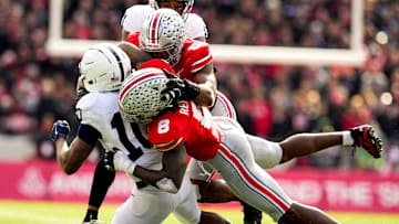 Ohio State Buckeyes linebacker Arvell Reese (8) and linebacker Sonny Styles (0) tackle Penn State Nittany Lions running back Nicholas Singleton (10) in the second half of the college football game at Ohio Stadium on Saturday, Nov. 1, 2025 in Columbus, Ohio.
