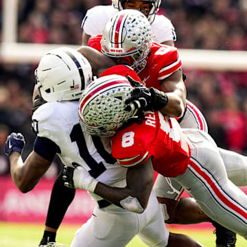 Ohio State Buckeyes linebacker Arvell Reese (8) and linebacker Sonny Styles (0) tackle Penn State Nittany Lions running back Nicholas Singleton (10) in the second half of the college football game at Ohio Stadium on Saturday, Nov. 1, 2025 in Columbus, Ohio.